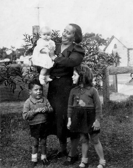 Violet Sutton with three of her children. Photo: Supplied.