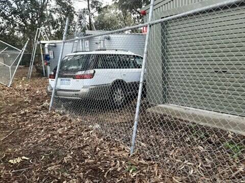 A car crashed into one of the water tanks at Peel Health Campus on Wednesday. Photos: Supplied.