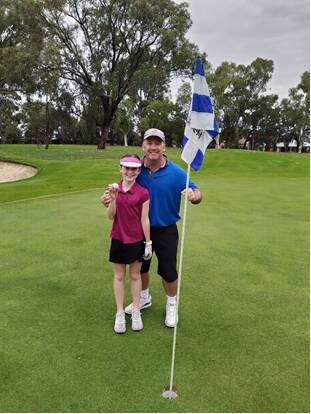 10-year-old Isabella Day with her dad, Alan after hitting a hole-in-one. Photo: Supplied.