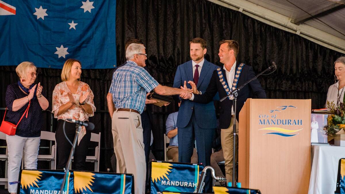 Mayor Rhys Williams presents Community Citizen of the Year John Lawrence with his award at this years Australia Day ceremony.