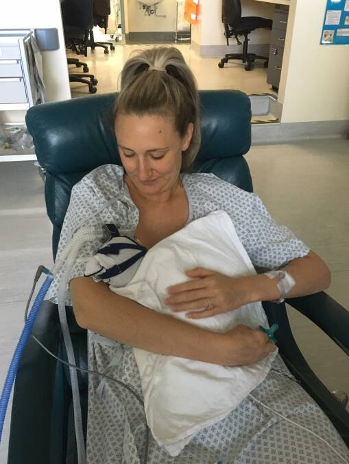Amber Ellis' first cuddle with baby Indigo.