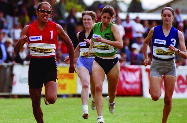 A GREAT GIFT: Cathy Freeman, left, powers ahead in the 400m handicap race in 1996. 