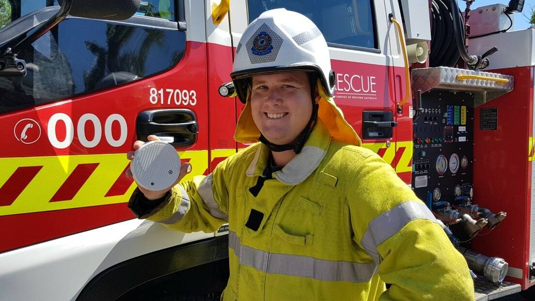 SAFETY MESSAGE: Falcon Volunteer Fire and Rescue Service firefighter Jesse Blunt with a smoke alarm. Photo: Supplied.