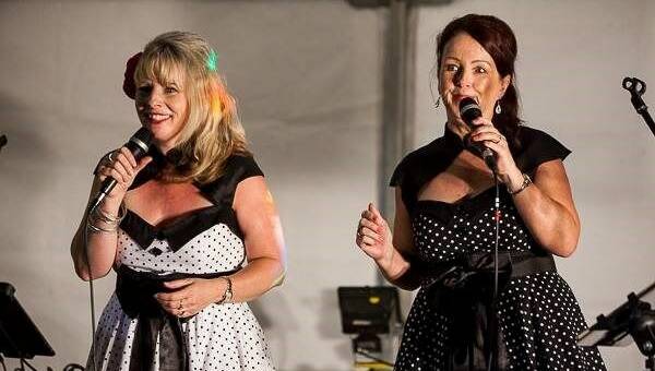 Busy social calendar: 7th Heaven performers Catherine Cary and Cathy Mueller performing recently. Photo: Supplied. 