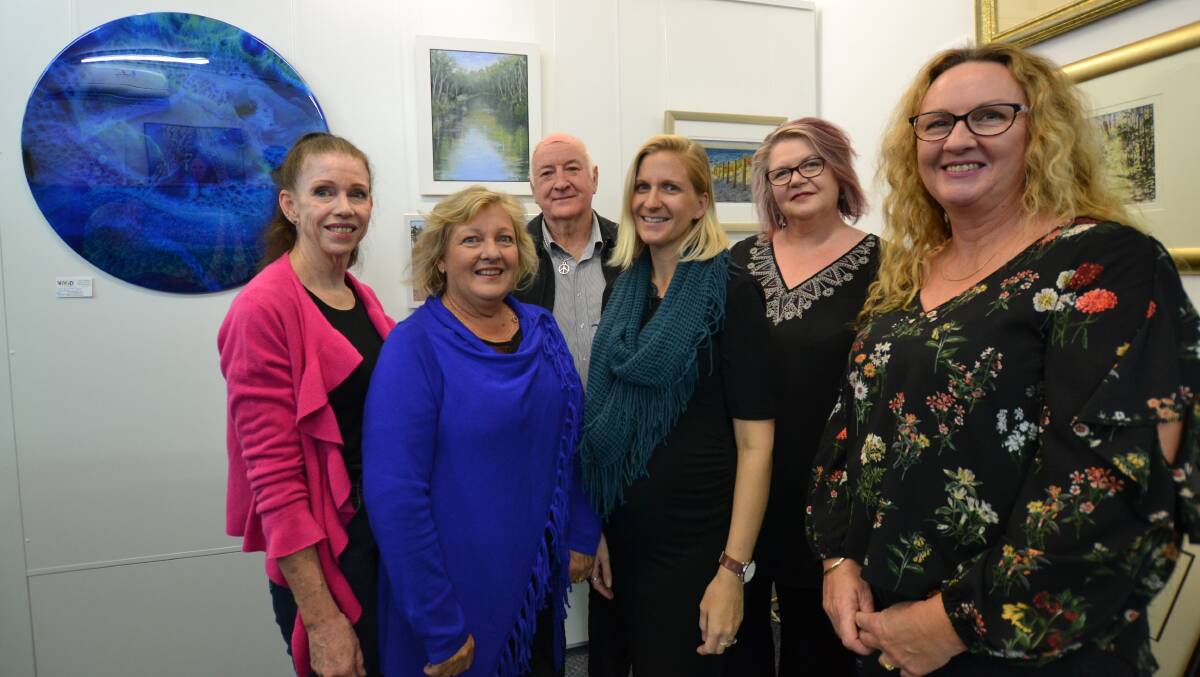 On display: The Vivid Art Gallery artists Karen O'Keefe, Carol Hazel, Boyd Parry, Lucy Thompson, Donna Ree Muir and Corrine Rapley. Photo: Amy Martin. 