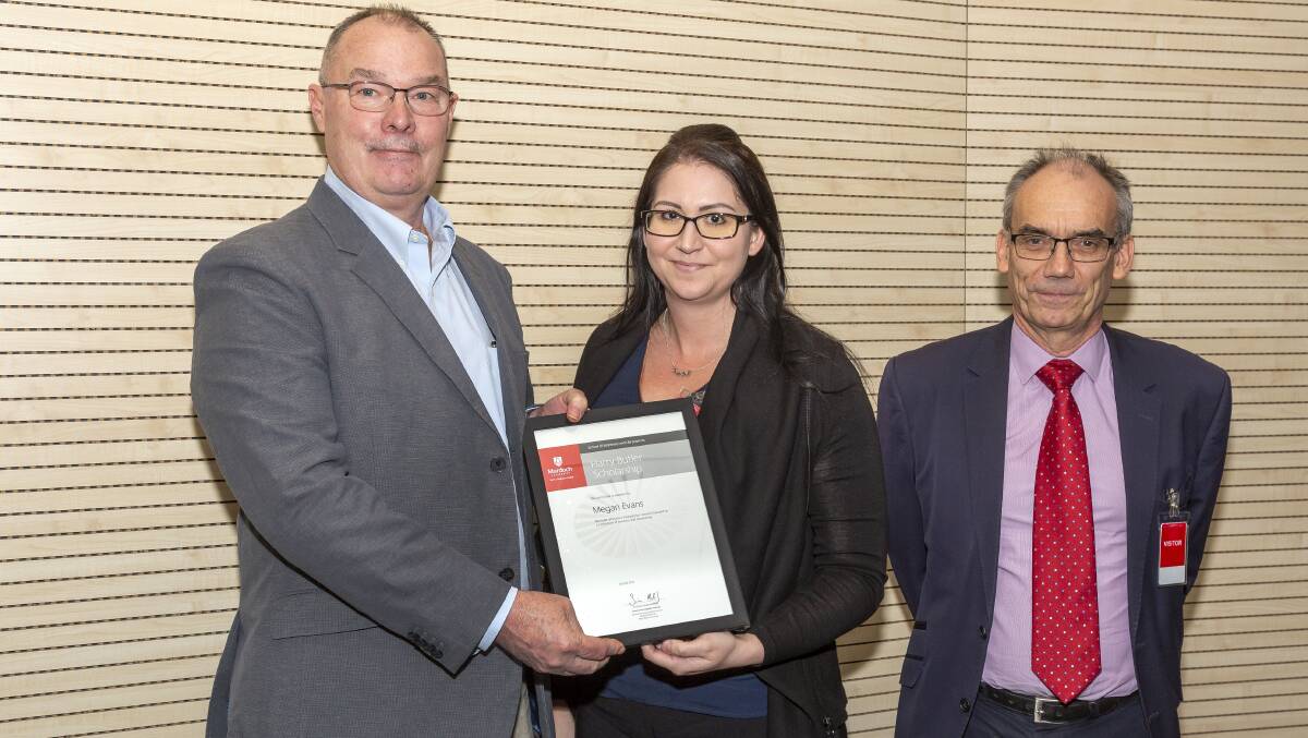 Megan Evans receiving her scholarship from Chevron General Manager Operations Kevin Owens and Murdoch University deputy vice chancellor David Morrison. Photo supplied. 