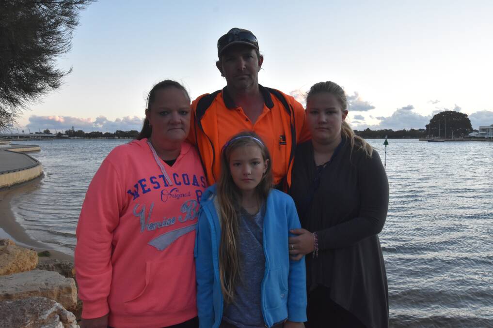 Kristy and John James and their children Kiara and Chelsea were returning from a family fishing trip when they witnessed a boat rounding up and chasing a group of dolphins in Mandurah. Photo: Kaylee Meerton.