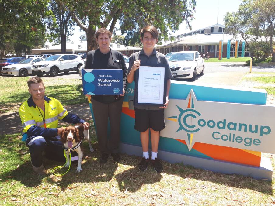 Water Corporation’s Andrew Blair with leak-detection dog Kep, Coodanup College Principal Vicki McKeown and student Reece Lego. Photo: Supplied.