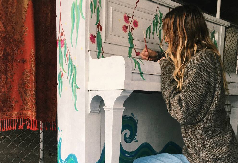 Artist Bonnie King with the travelling piano set to make its way around Mandurah. Photo: Supplied.