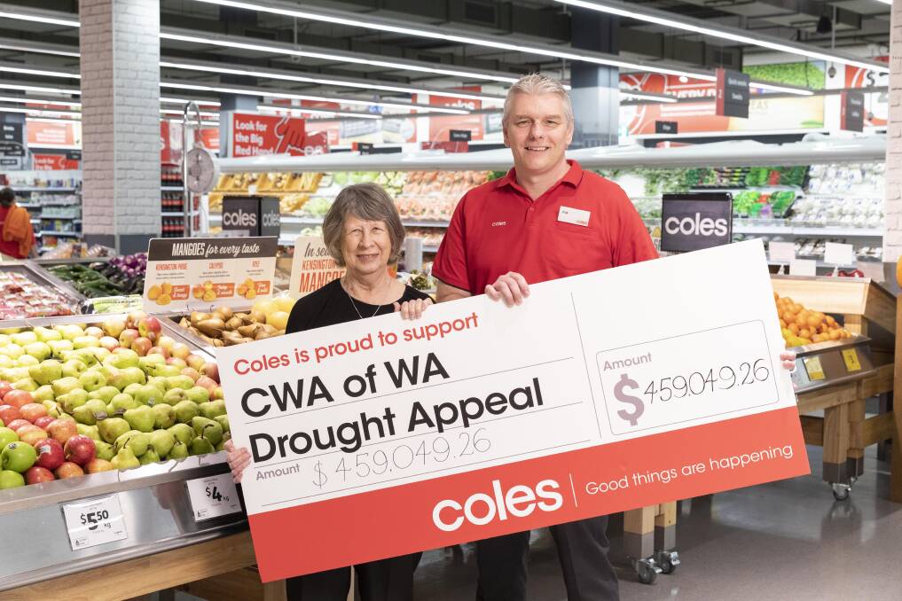 Country Women’s Association of WA state treasurer Margaret Hector receives a cheque from Coles state general manager Pat Zanetti. Photo: Supplied.