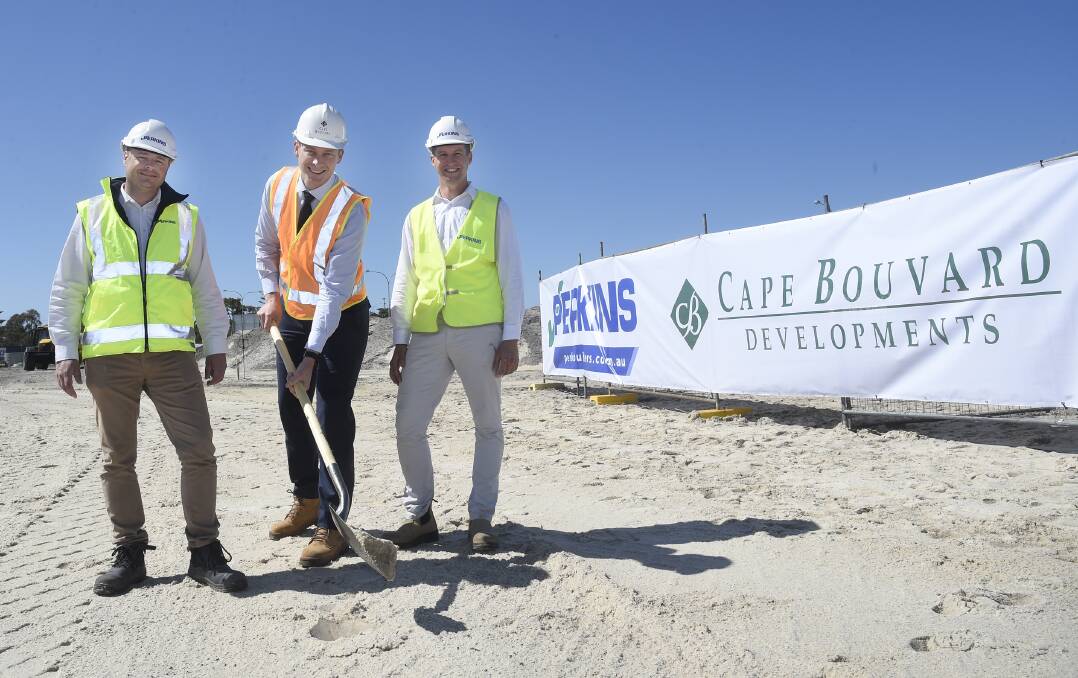Perkins Builders' Ray Daly, Cape Bouvard development manager Tristan Cribb
and Perkins Builders project manager Michael Pitts turning the first soil at the new Halls Head commercial centre. Photo: Supplied.