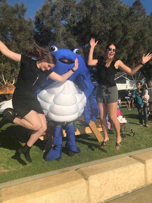 Mandurah Mail journalists Caitlyn Rintoul and Kaylee Meerton celebrate a successful weekend covering Crab Fest 2019. 