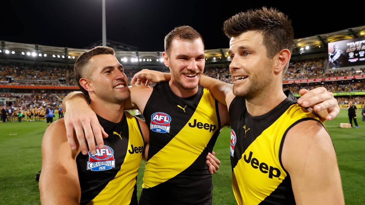Pinjarra product Kamdyn McIntosh (middle) pictured with Richmond teammates Jack Graham and skipper Trent Cotchin following their grand final victory over Geelong. Photo: Michael Wilson/AFL Photos.