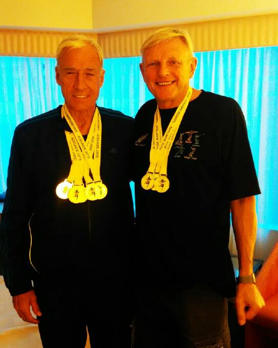 Jim Davis and Ossi Igel celebrate their victories at the Australian Masters Athletics Championships earlier this month.
