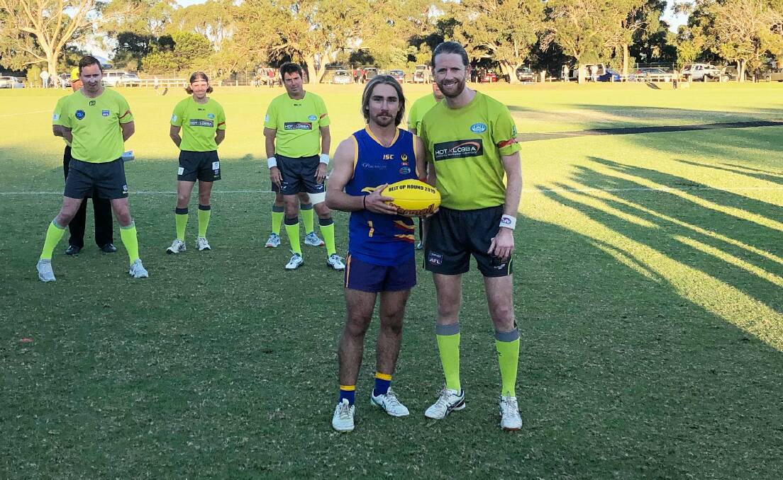 Jack Shanahan is presented the game ball after being judged best afield in the PFNL's Belt Up round. Photo: Supplied. 