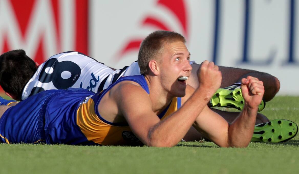 Oscar Allen watches one of his three goals go through against the Cats. Photo: AAP/Richard Wainwright.