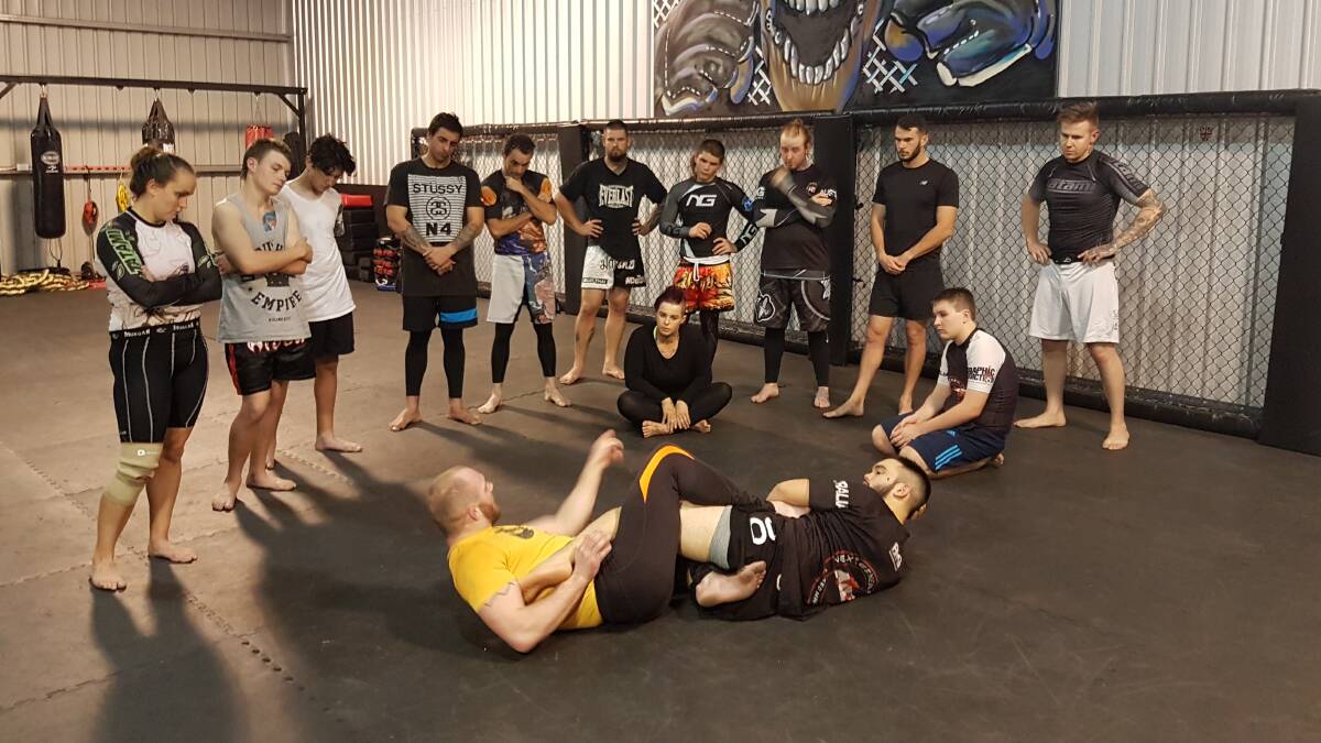 Chris Fishgold showing gym members some techniques. Photo: Supplied.