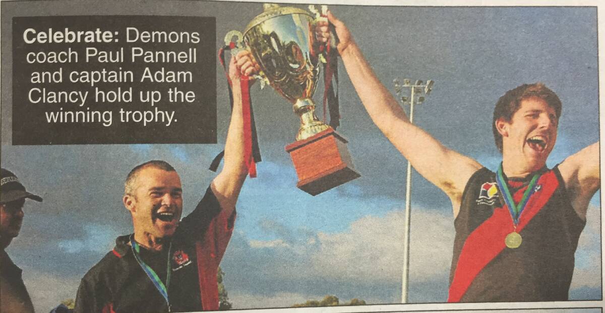 Coach Paul Pannell and captain Adam Clancy hoist the premiership trophy. Photo: Mandurah Mail.