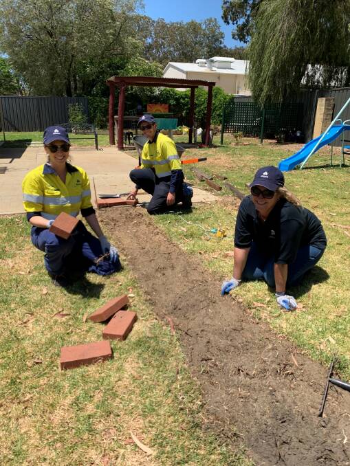 Alcoa employees Caitlin Bayliss, Kristian Gustafsson and Stacy Hogan volunteering for Safe Woman Safe Family Pinjarra. Photo: Supplied.