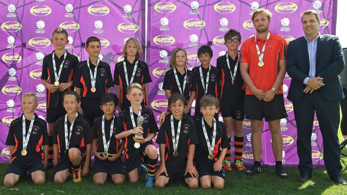 The Peel Junior Soccer Association's under 11 boys went unbeaten on their way to a victory at Country Week. Photo: Supplied.