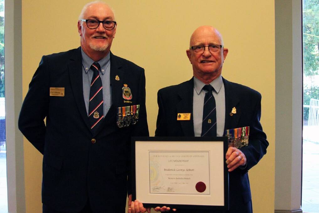 Dawesville RSL president Col Gibson presents Fred Abbott with life membership. Photo: Supplied.      
