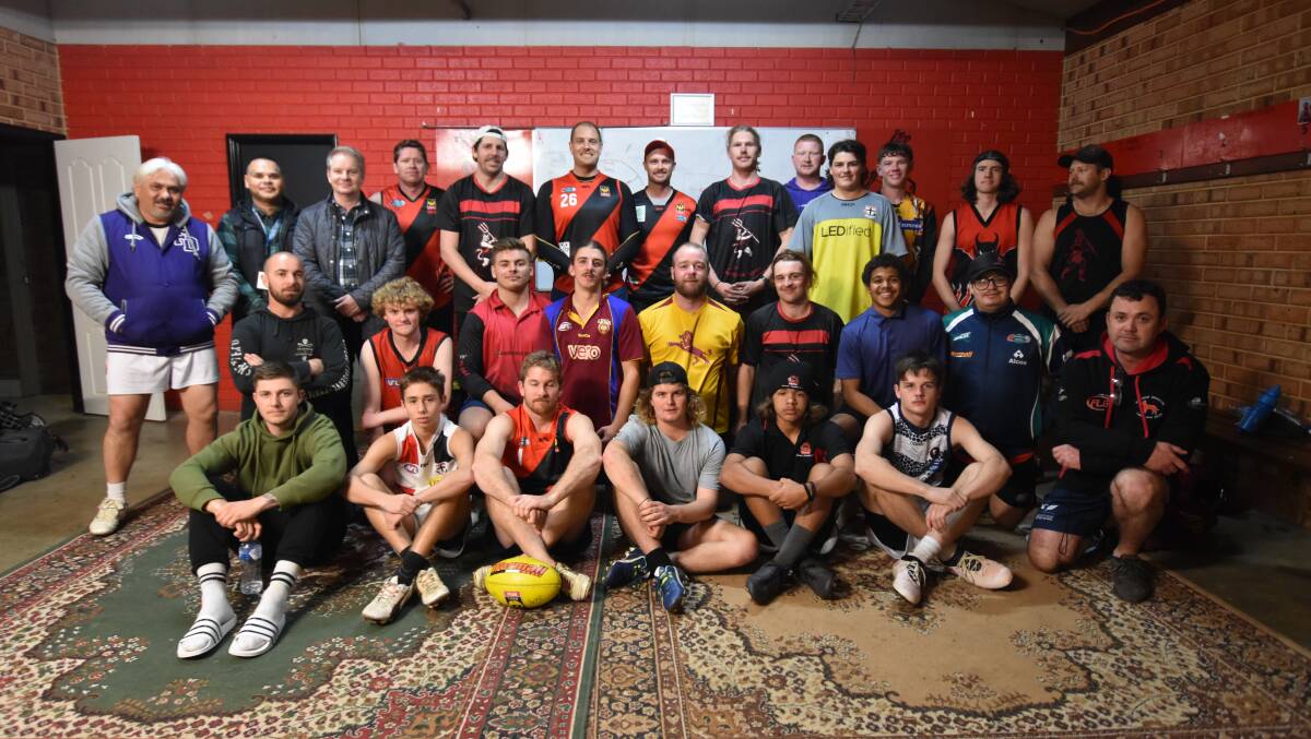 PYMS workers Paul Reilly and Luke Beeson stopped by the Waroona Football Club on Tuesday night. Photo: Justin Rake.