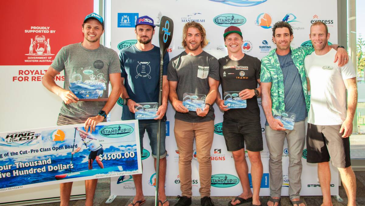 Jake Jensen celebrates his win alongside Titouan Puyo, James Casey, Michael Booth, Travis Grant and Cameron McKay from Stand Up Surf Shop. Photo: Neng Chunthanom.   