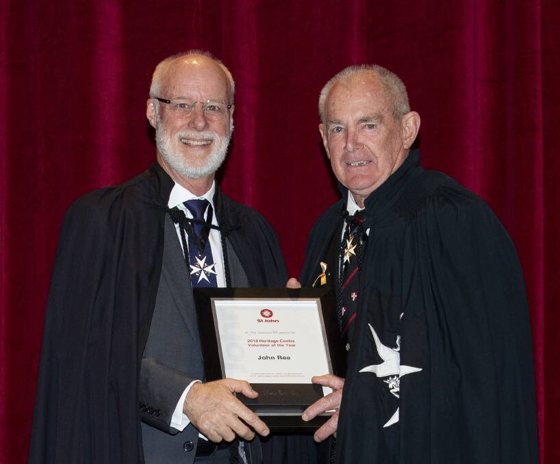 St John Chairman Shayne Leslie presents John Ree with his award. Photo: Supplied.