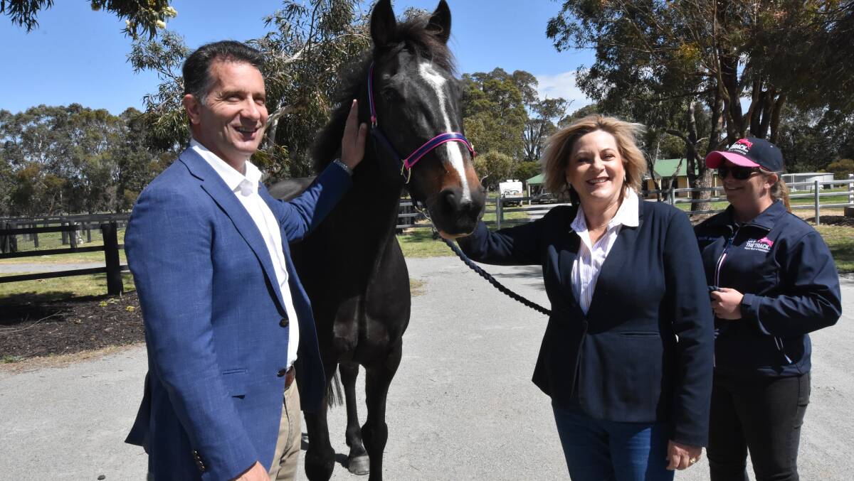 Racing and gaming minister Paul Papalia and Murray-Wellington MP Robyn Clarke with Norvic Nightowl. Photo: Justin Rake. 