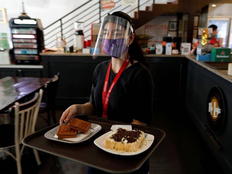 Cafes and restaurants have reopened in Jakarta as Indonesia eases coronavirus restrictions.