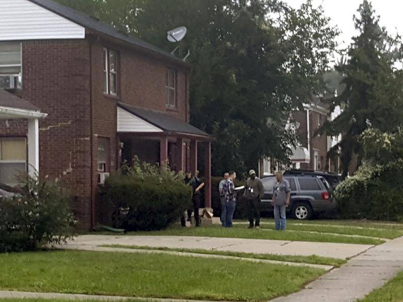 Police have shot a man at a Detroit home while investigating the shooting of a mother and daughter.