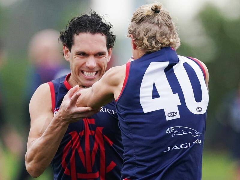 Demon Harley Bennell (l) will play his first AFL game in 34 months this weekend against Carlton.