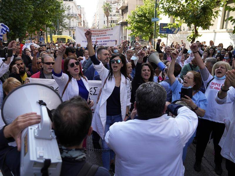 Greek health care workers have marched in a protest against compulsory coronavirus vaccinations.