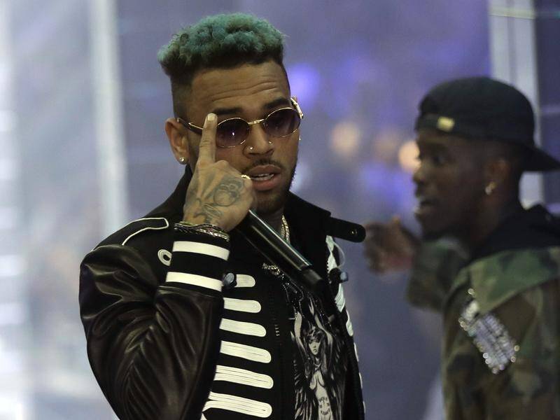 Singer Chris Brown has been arrested in France after a woman filed a rape complaint.