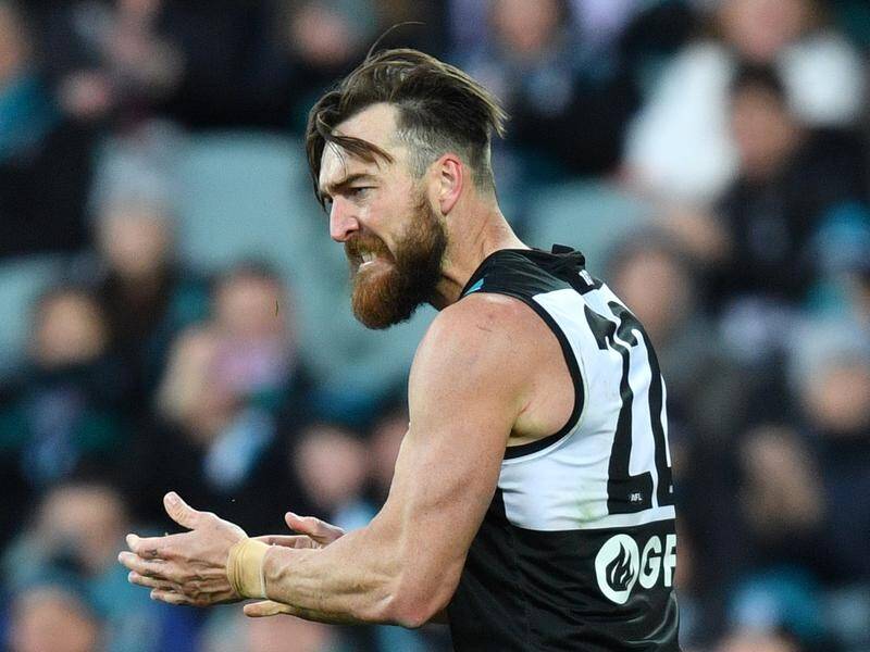 Three Charlie Dixon goals have helped Port Adelaide to a 43-point AFL defeat of Fremantle.