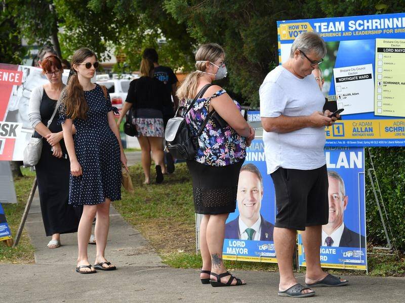 Queenslanders were urged to maintain a 1.5m distance when voting in local government elections.