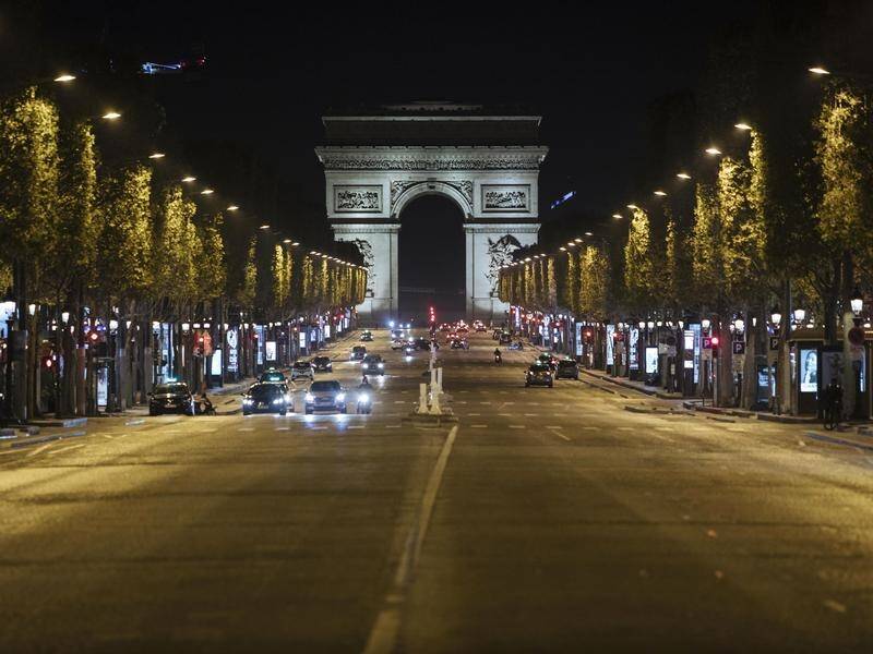 Paris streets emptied on Saturday night after a curfew was imposed to slow the spread of COVID-19.