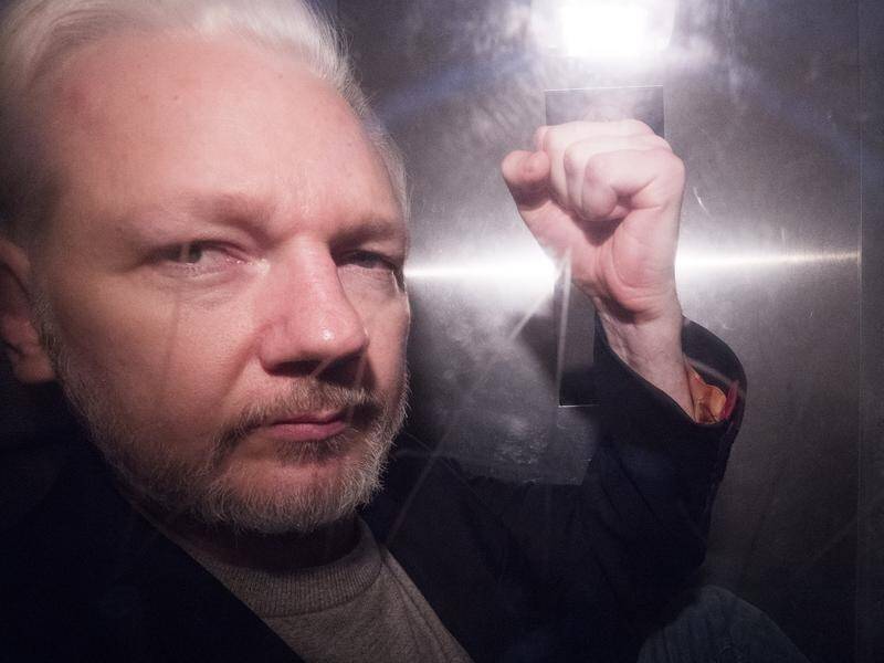 Julian Assange will remain behind bars in the UK despite his jail term ending.