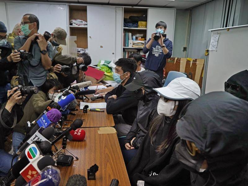 Relatives of Hong Kong activists detained at sea and facing court attend a press conference.