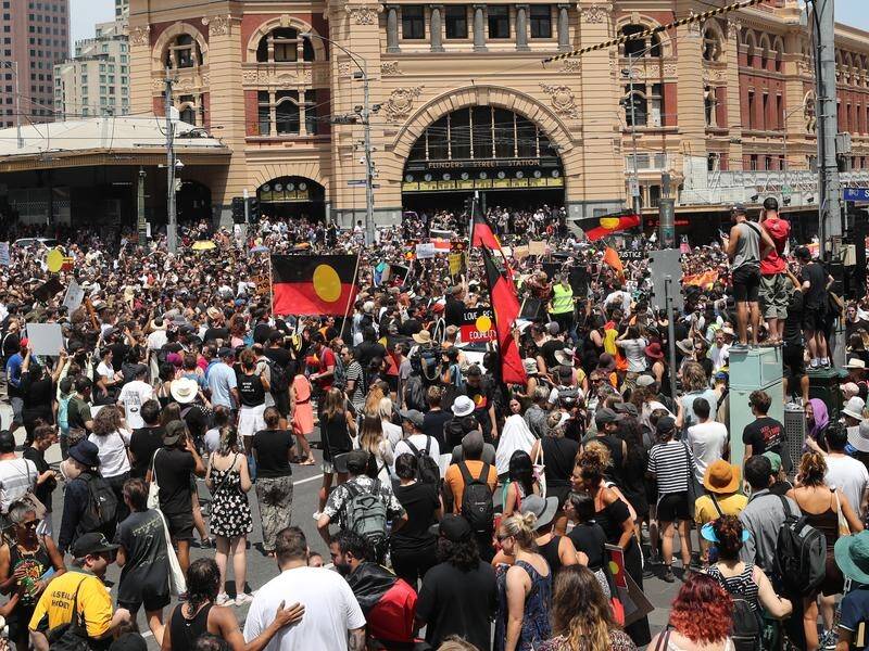 Thousands gathered to protest Australia Day at a rally outside Melbourne's Flinders St station.