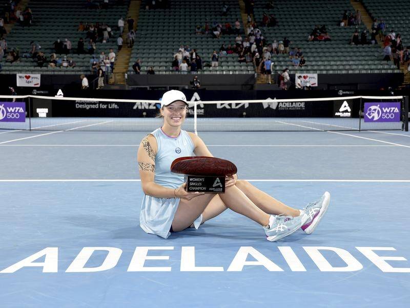 Poland's teenage star Iga Swiatek poses with her trophy after winning the Adelaide International.