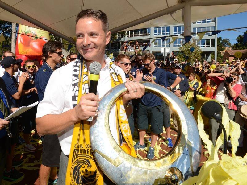 Mariners owner Mike Charlesworth, seen with the 2013 A-League trophy, has put the club up for sale.