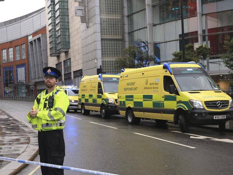 A man has been arrested after five people were stabbed at a shopping centre in Manchester.