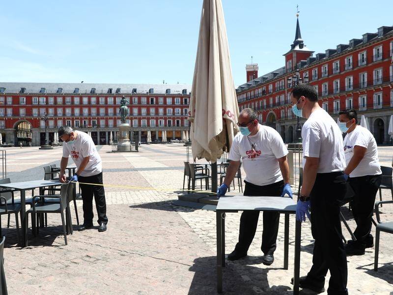 A cafe prepares to open in Madrid's Plaza Mayor Square. Spain hopes to welcome tourists in July.