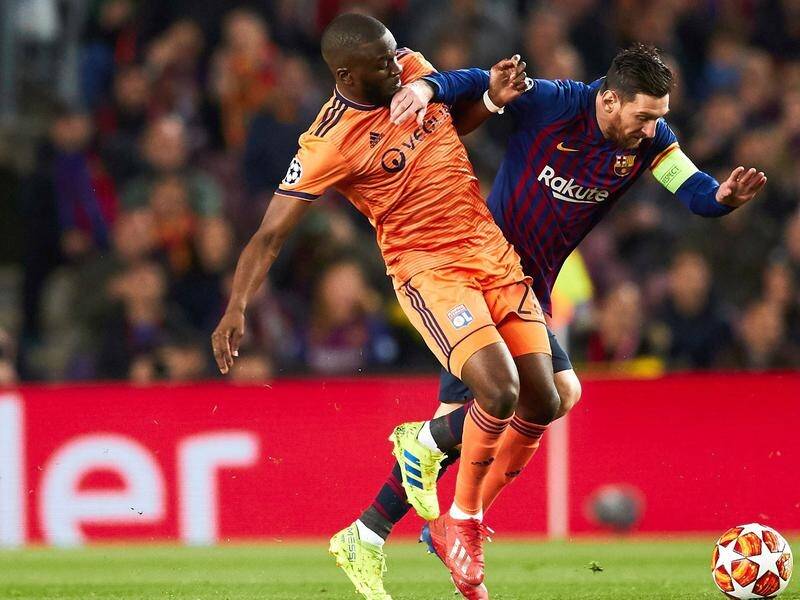 Tanguy Ndombele (l), seen competing with Barcelona's Lionel Messi, has joined Tottenham from Lyon.