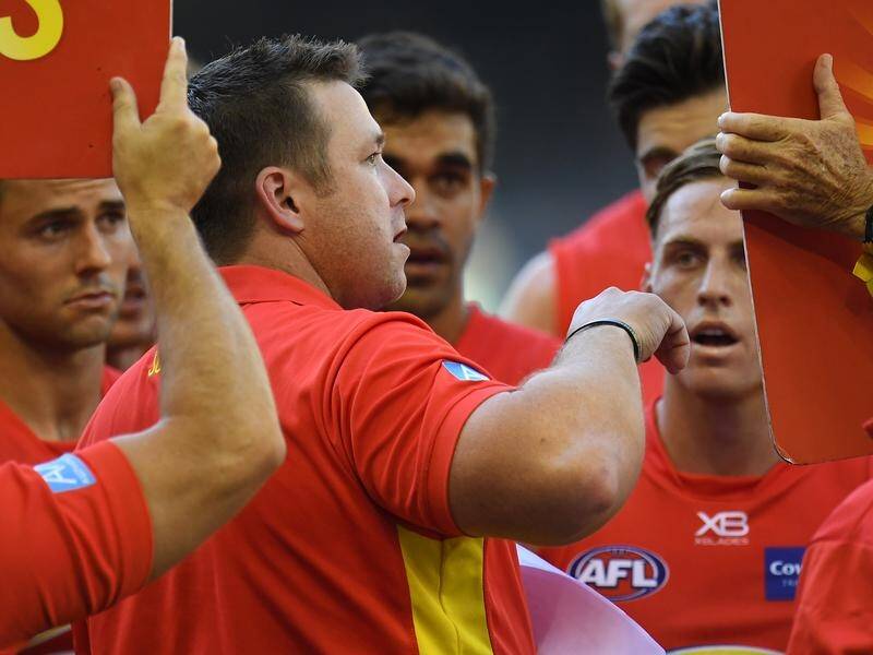 Gold Coast won just four AFL games in Stuart Dew's first season in charge.