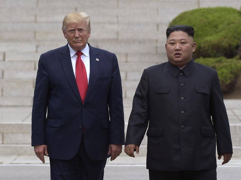 It is unlikely Donald Trump (L) and North Korea's Kim Jong-un will meet before the November polls.