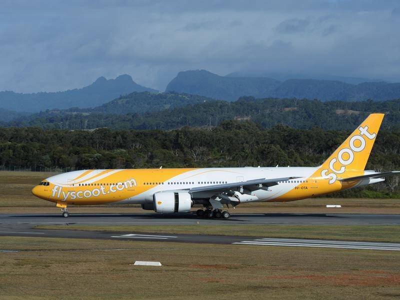 A Scoot flight from the Gold Coast to Singapore was forced to turn around after a man became unruly.