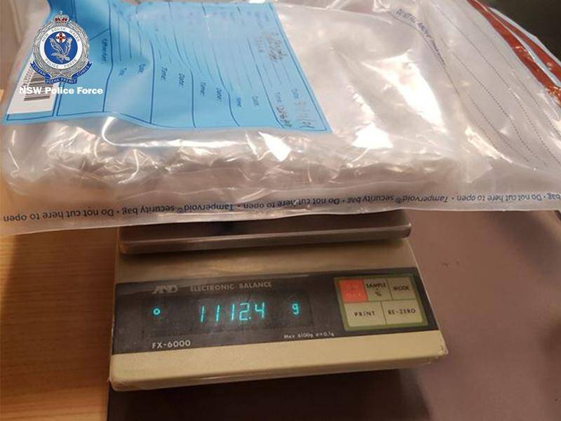 NSW Police found two vacuum-sealed bags of heroin in a Sydney taxi and have charged the passenger.