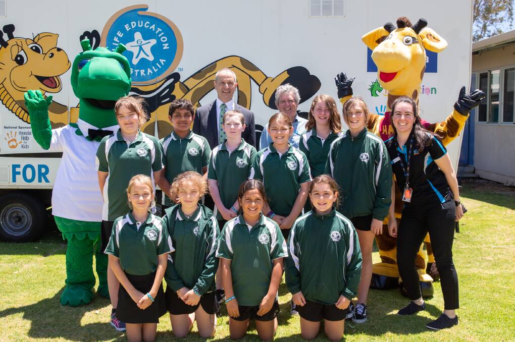 HAPPY AND HEALTHY: Tony Monaco and Bernie Foley with children from Greenfields Primary School. Photo: Supplied